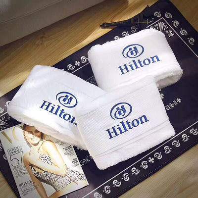 Tejido de algodón 100% de color sólido Logotipo personalizado Toallita de baño para baño de hotel de lujo