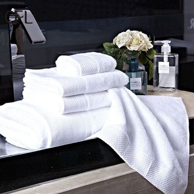 Lujo 100% de algodón blanco baño Toallita para la mano y la cara con logotipo bordado a medida 70 * 140cm